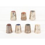 Seven British silver 'stone' top thimbles comprising three by James Swann and Son and a set of
