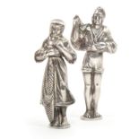 A pair of 19th Century silver figural standing needle cases, probably German, the male figure in