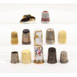 A mixed lot of thimbles comprising three 19th Century ivory examples, a silver example 'Royal