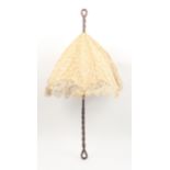 An attractive Victorian parasol, the lace shade on a rosewood spiral twist handle with open handle