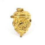 An 18th Century gilded metal thimble case of shaped oval section variously decorated, hinged cover