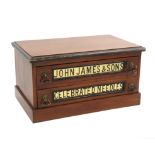 A late 19th Century mahogany two drawer advertising counter chest, the drawers with inset glass