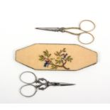 Two pairs of mid-19th Century scissors and a needlework case comprising a pair of scissors the
