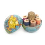A novelty miniature sewing companion contained in a colour printed metal globe, marked 'Made In