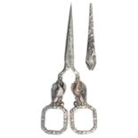 A pair of silver mounted scissors with sheath, oval section tapering blades, the arms as Imperial