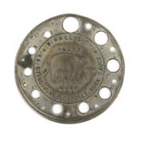 A scarce plated metal knitting pin gauge of circular form inscribed 'W. Hall and Cos Knitting Pin