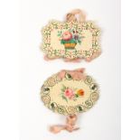 Two 19th Century punched card, floral painted and embroidered needle books comprising an oval