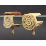 Two early 19th Century Canton carved ivory sewing clamps, one with flowerhead end below a pin