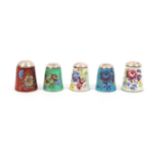 Five silver and enamel thimbles by James Swann and Son, all with floral decoration, all with