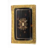 A 19th Century tortoiseshell and gilt metal notelet book the cover with gold cartouche within