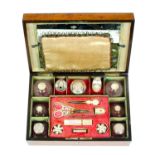 A French Palais Royal musical travelling and sewing box, in burr walnut edged in ebony and of