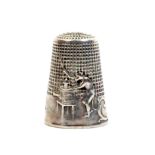 A French silver 'fairy tale' thimble, 'The Monkey and the Magic Lantern', the frieze with a monkey