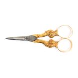 A pair of mid-19th Century gold mounted scissors, the diamond section tapering blades to leaf and