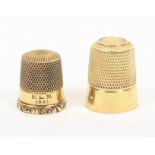 Two American gold thimbles each marked to the internal apex 14, one with scroll rim, the other plain