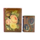 Two Spa work needle books each with floral painted boards, the larger with leather spine, 8.5cm, the