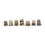 Seven various thimbles all in white metal comprising six with niello style decoration, one holed,