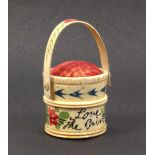 An early 19th Century bone bucket form pin cushion painted with flowers and other motifs and