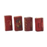 Four red leather needle packet boxes comprising two wallet form examples both titled 'Needles' and