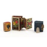 Two book form boxes and an emery comprising a velvet covered example decorated with scraps, the