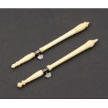 Two 19th Century ivory tambour hooks each with steel band and turn-key and in three sections,