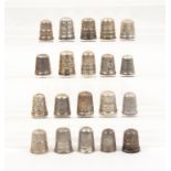 Twenty British silver thimbles mostly with decorative borders, mostly early 20th Century (20)