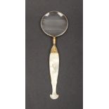 A Palais Royal magnifying glass, the mother of pearl carved handle inset to one side with a silver