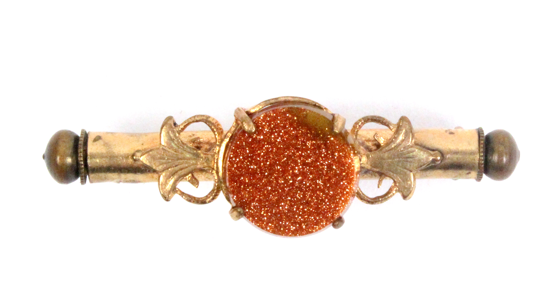 A nanny brooch, circular spangle in leaf and scroll mount, stamped 'DRGM 682605', 4.5cm