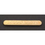 A fine early 19th Century ivory needle case, of rounded end rectangular form, one side carved with