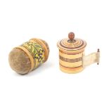 A painted Tunbridge ware tape measure and a girdle pin cushion, the tape measure of cylinder form