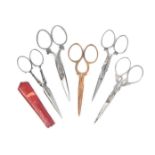 Five pairs of 19th Century scissors comprising four steel pairs one with leather sheath, 9.5cm and a