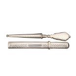 A 19th Century Dutch silver stiletto and matching needle case, the stiletto with screw cover, the