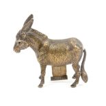 A brass novelty tape measure in the form of a donkey or mule, one eye lacking, the complete tape