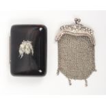 Two purses comprising a silver chain example the clasp decorated in the Art Nouveau style with