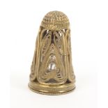 A late 18th Century/early 19th Century gilded filigree scent bottle thimble, the tall thimble in