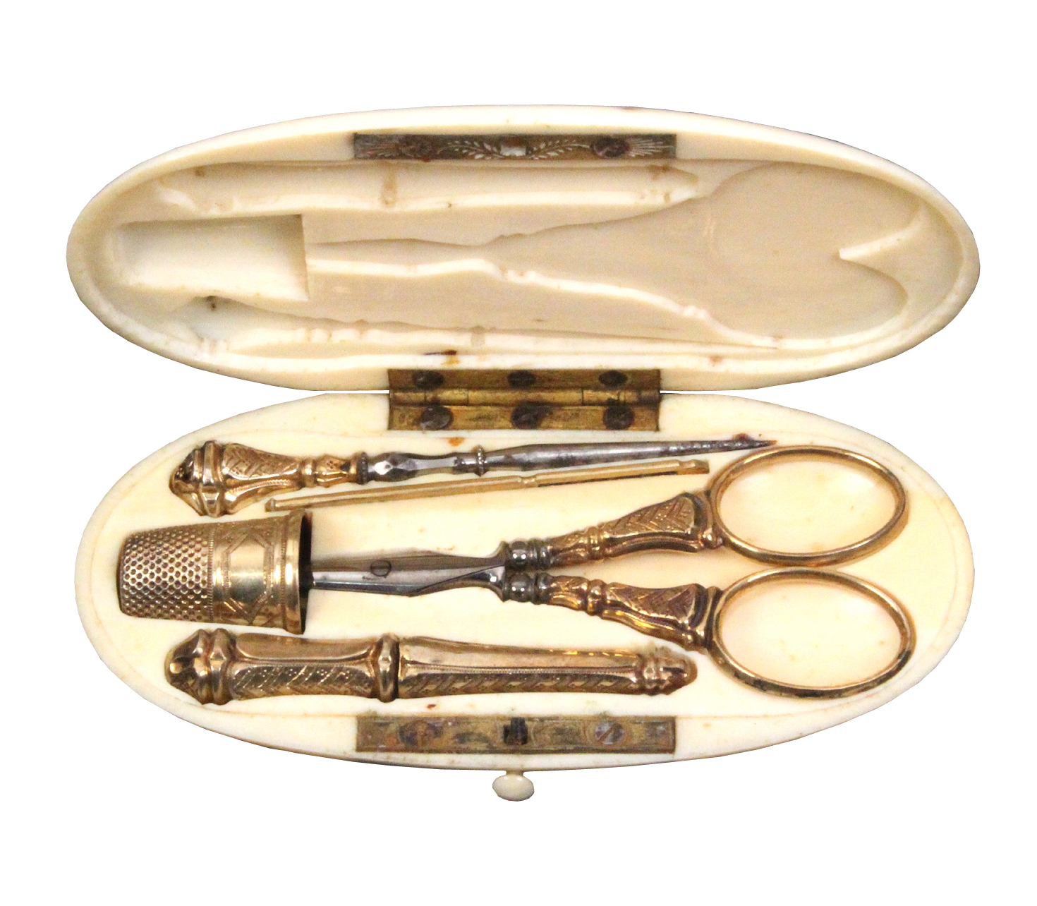 A French oval ivory etui, gilt metal fittings, circa 1890, the case with engraved monogram 'SIC',
