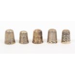 Five British silver thimbles with raised letter borders for James Walker comprising James Walker.