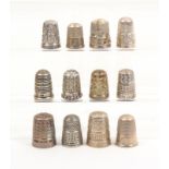 Twelve British silver thimbles of attractive design mostly early 20th Century (12)