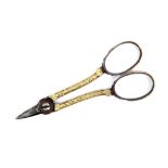 A pair of late 18th Century scissors mounted in gold the short blades with engraved two-colour