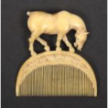 An 18th Century or earlier ivory comb, the semi-circular comb with floral carved border below a