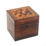 A rosewood Tunbridge ware tea caddy of rectangular form, the lid with a cube work panel within