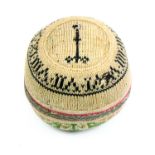 A good late 18th Century knitted pin ball one side in black and cream depicting the face of a