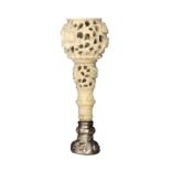 A good mid-19th Century Chinese carved ivory seal handle pierced and carved with flowers and leaves,