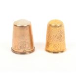 Two antique gold thimbles comprising an example with leaf scroll engraved frieze, and a Scandinavian