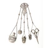 An English silver chatelaine, the hinged hook to an elaborate pierced mount with cupid firing an