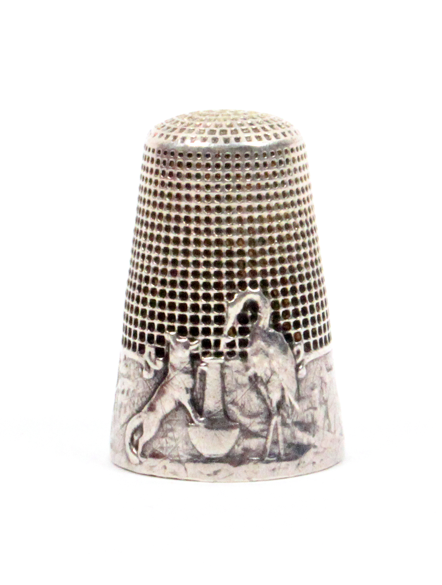 A French silver 'fairy tale' thimble, 'The Stork and the Wolf', the frieze with fox, stork and