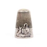 A French silver 'fairy tale' thimble, 'The Stork and the Wolf', the frieze with fox, stork and