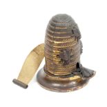 A rare brass novelty tape measure in the form of a bee skep with four bees, the complete tape in ins