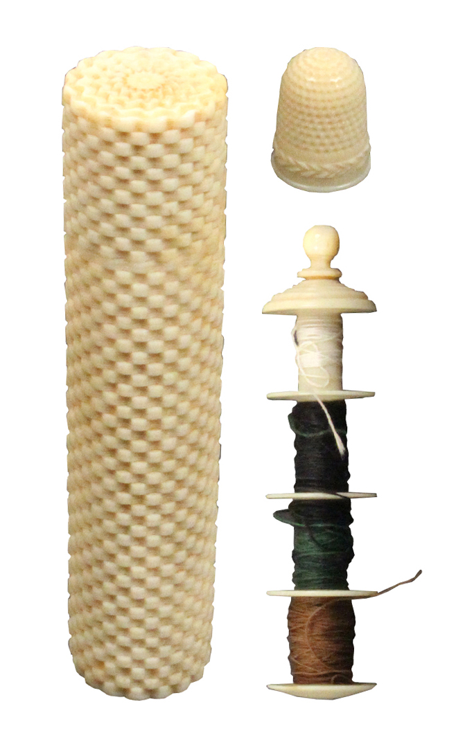 An early 19th Century ivory sewing companion the cylinder form case of stacked brick design, screw