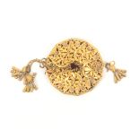 A Palais Royal style gilt metal opera purse of circular form with leaf pierced panels and