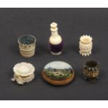 Five pin cushions and emeries comprises a reverse glass decorated disc form example titled '